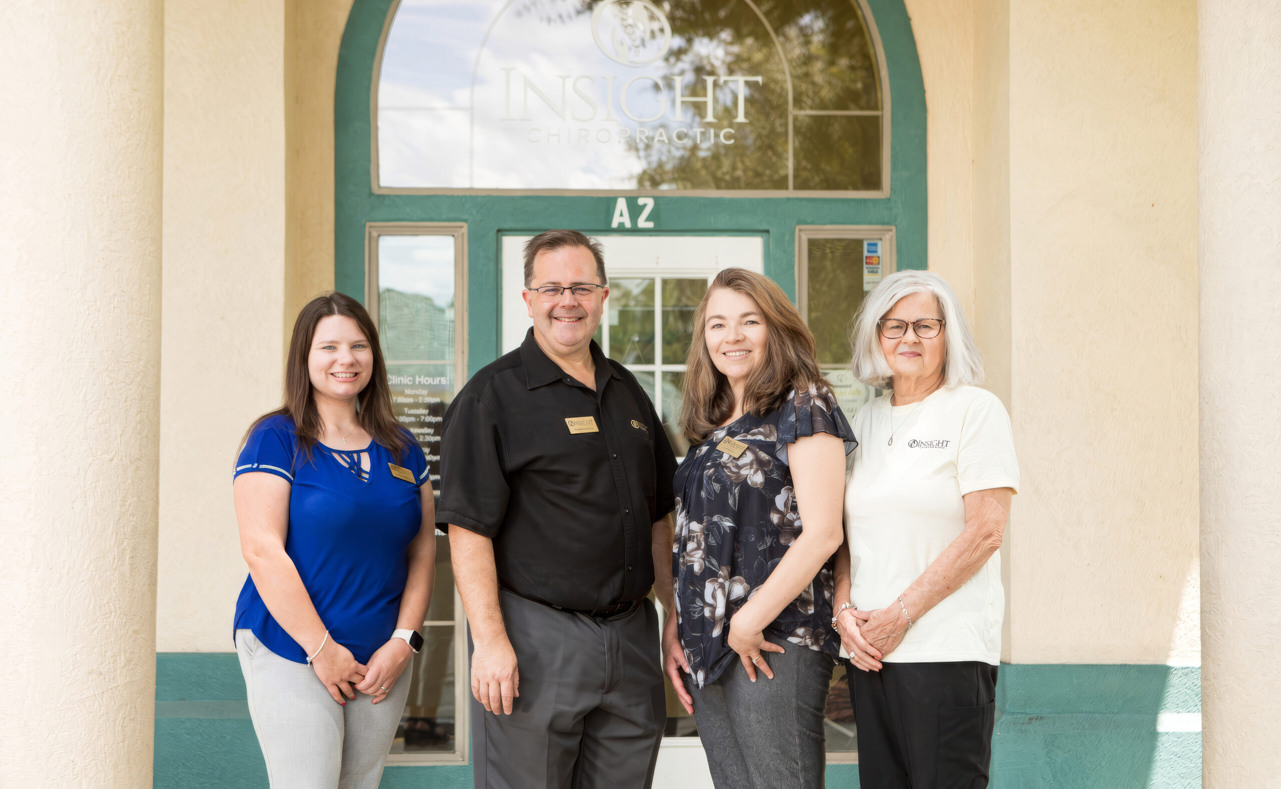 Dr. Michael Cox and the Insight Chiropractic team at the entrance of the practice, 290 Clyde Morris Blvd Ste a-2, Ormond Beach